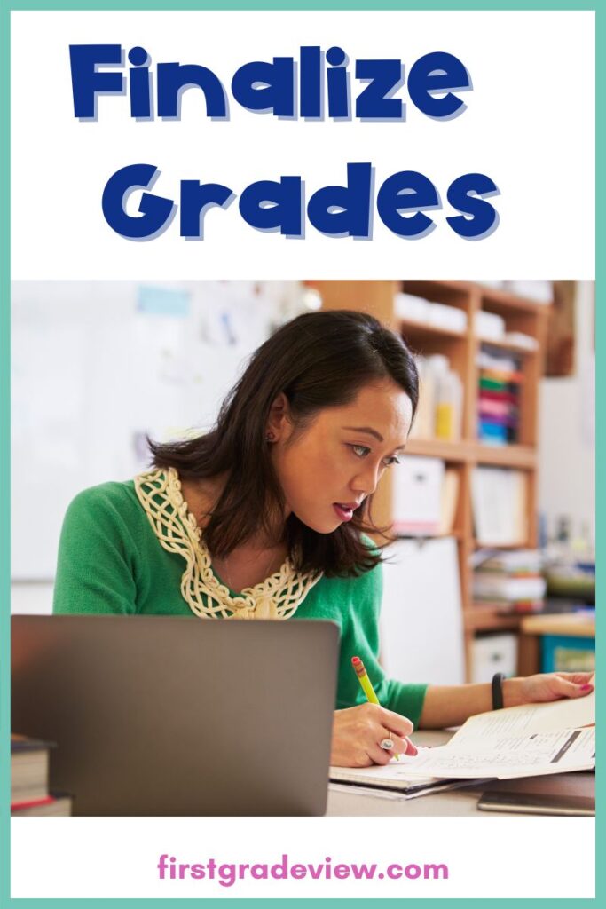 Image of teacher sitting at desk grading papers. 