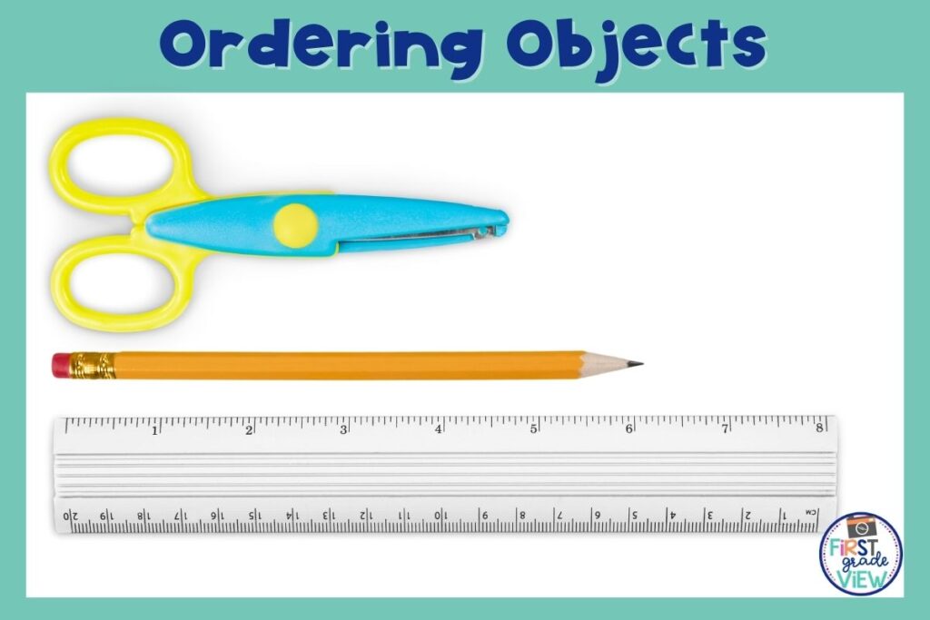 Image of a pair of scissors, pencil, and ruler arranged in order by shortest to longest. 